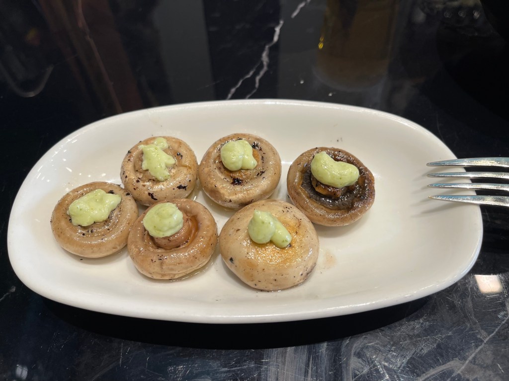 Grilled mushrooms topped with green aioli at Las Golondrinas in Seville.
